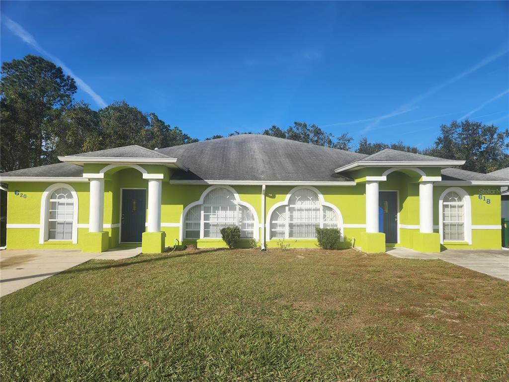 a view of a building with a big yard