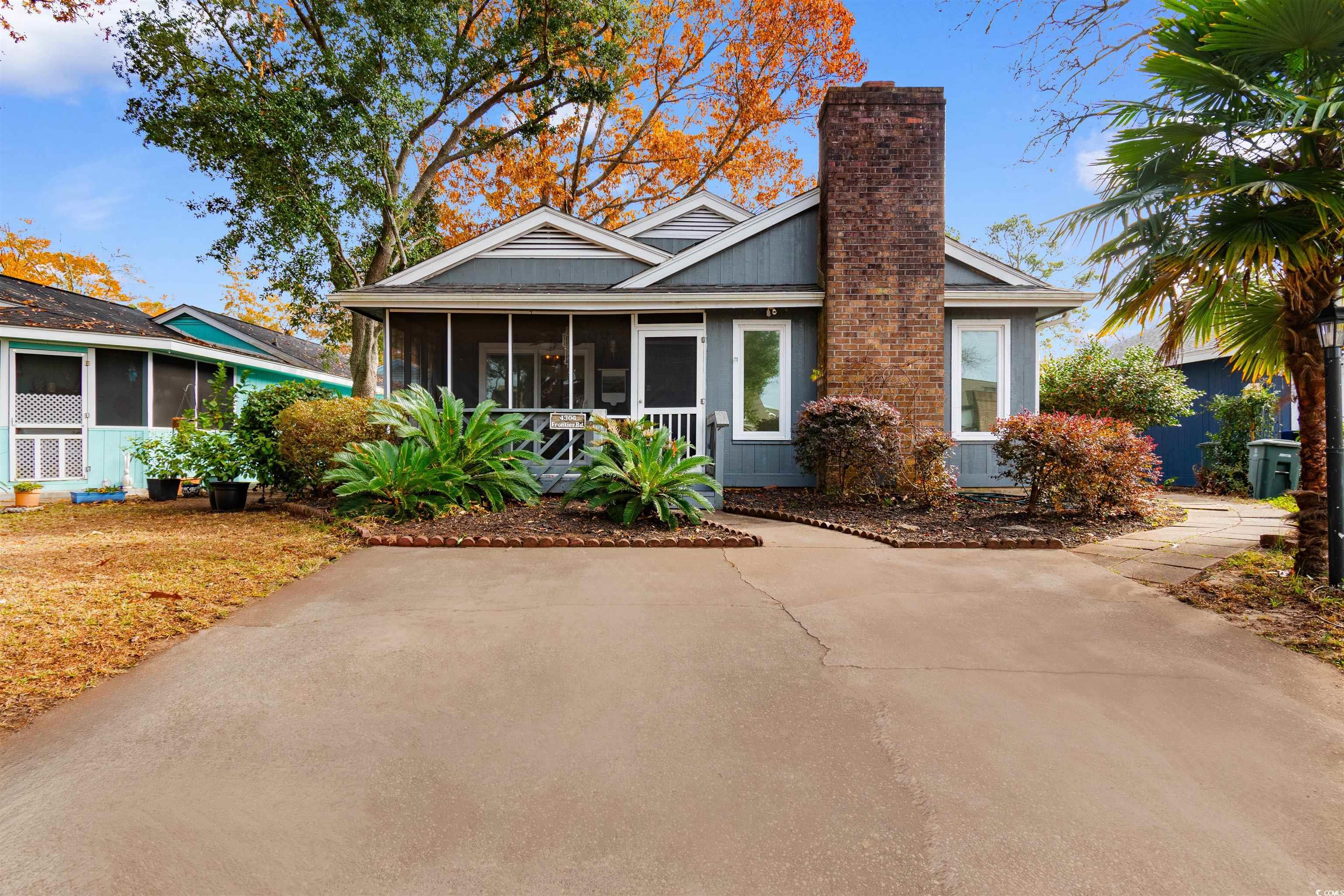 View of front of house with a sunroom