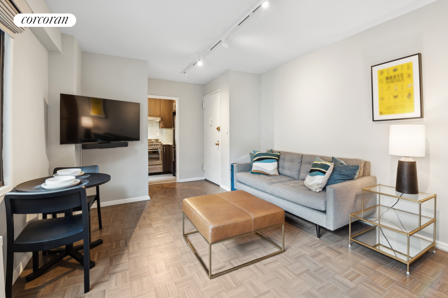 a living room with furniture and a flat screen tv