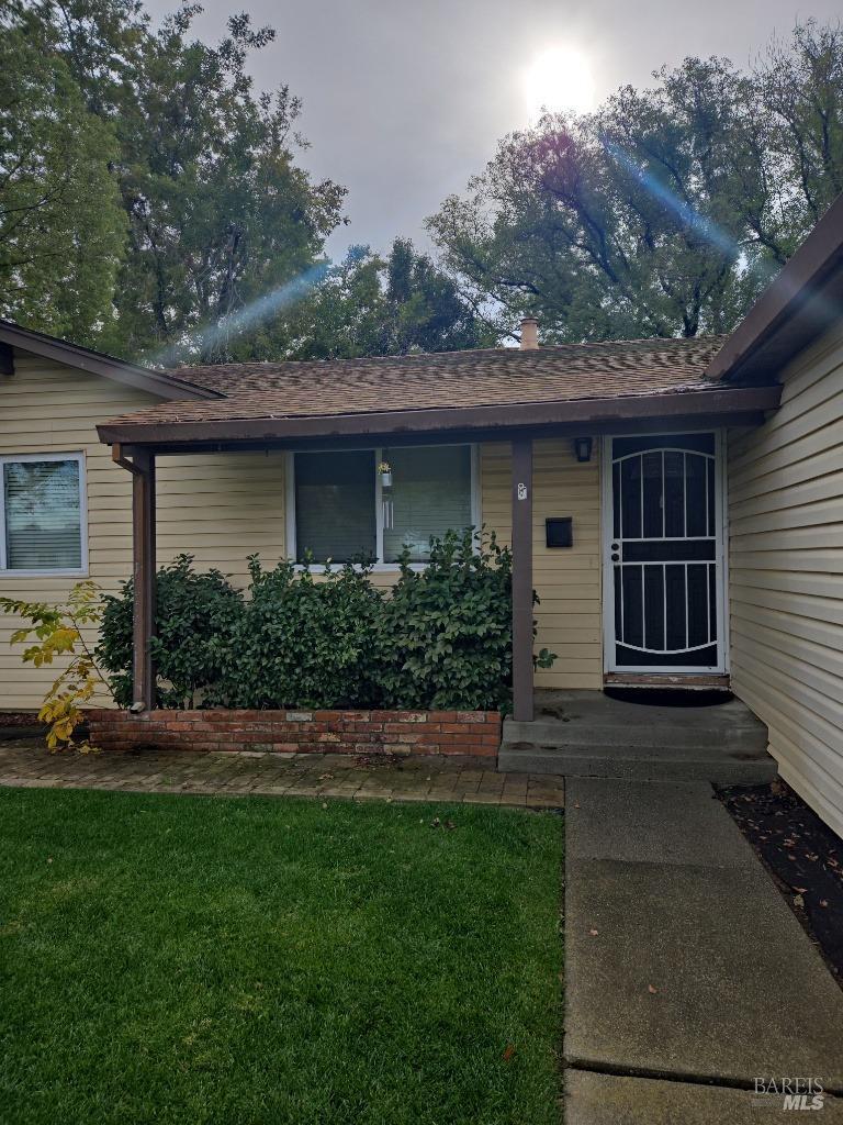 a front view of a house with a garden