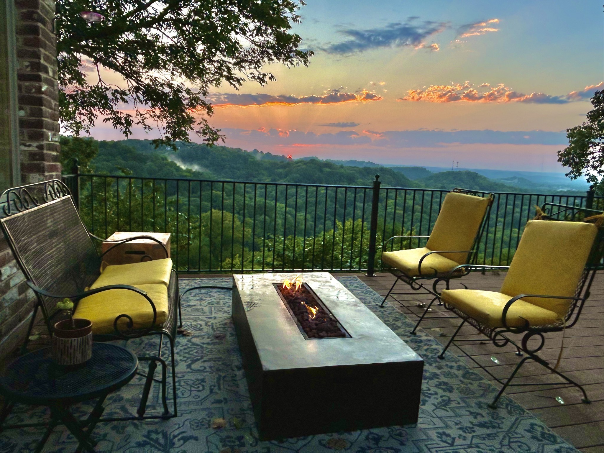 a view of a chairs and table in patio