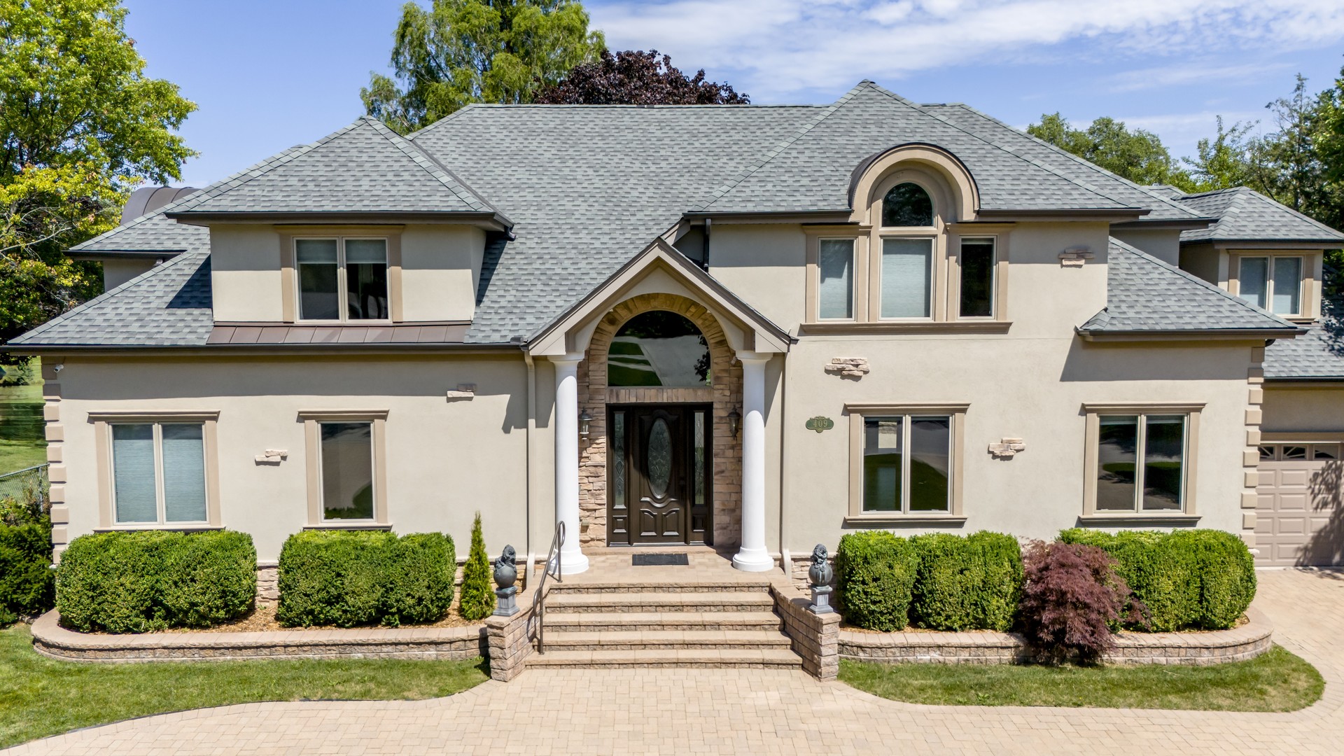 a front view of a house with a yard