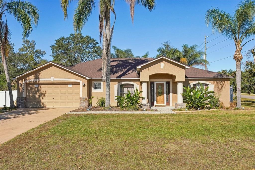 a front view of a house with a yard