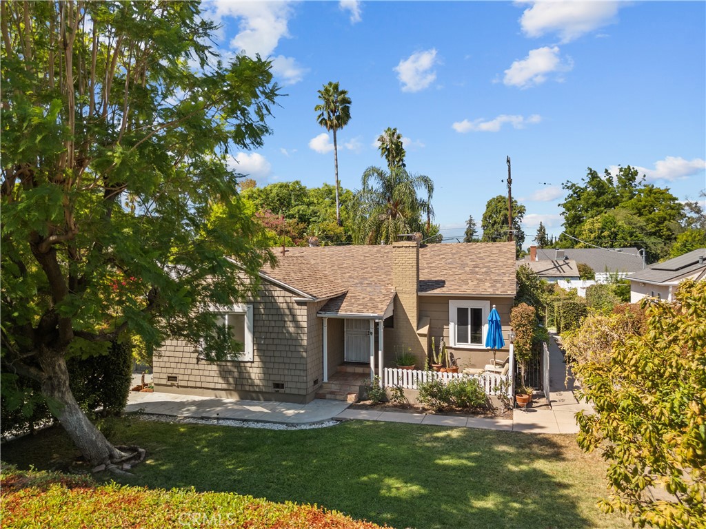 front view of a house with a yard