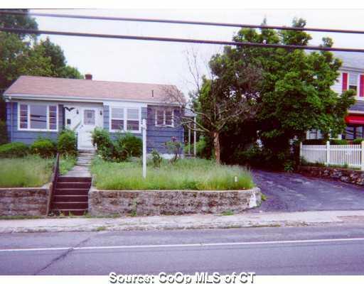 a view of a house with a street