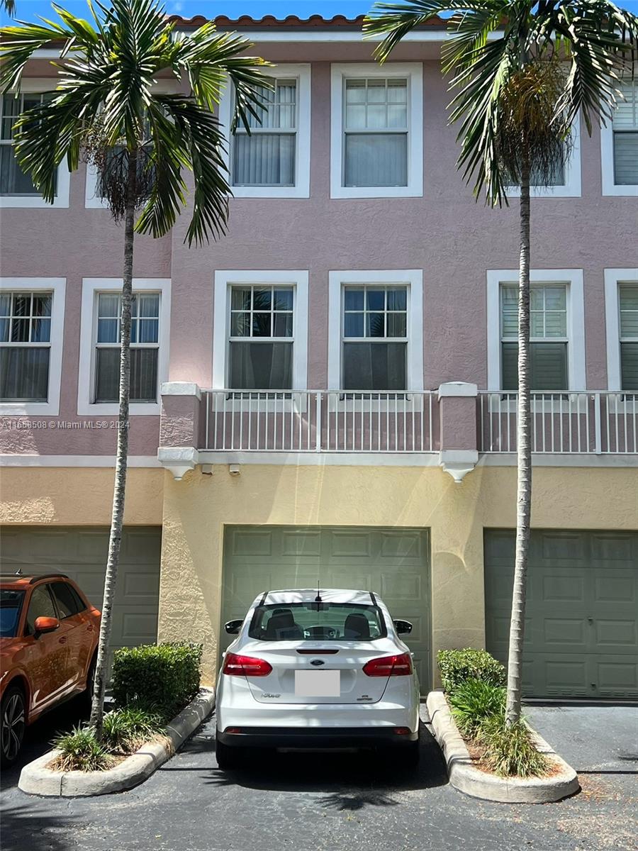 a car parked in front of a house