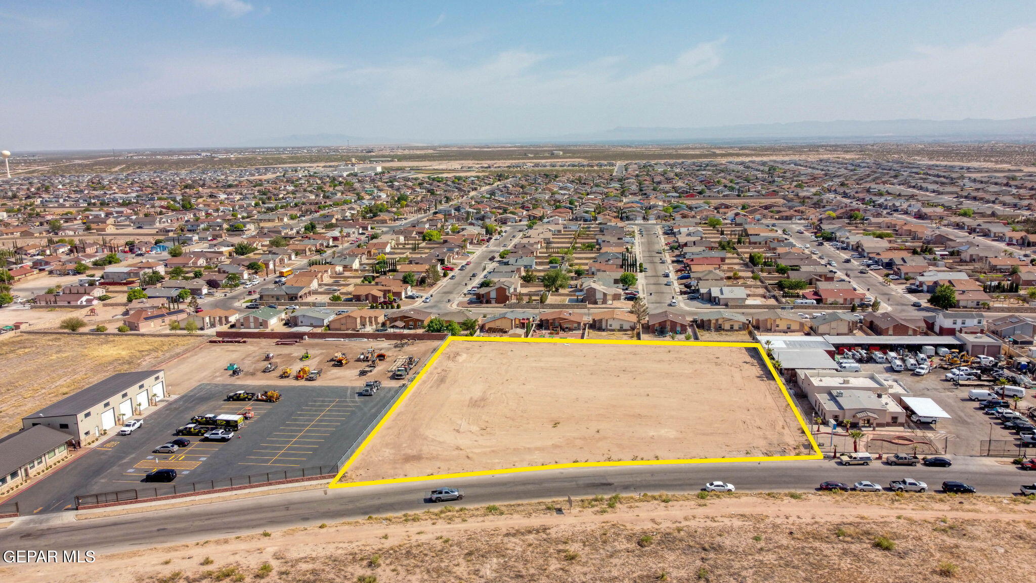 an aerial view of residential building and ocean