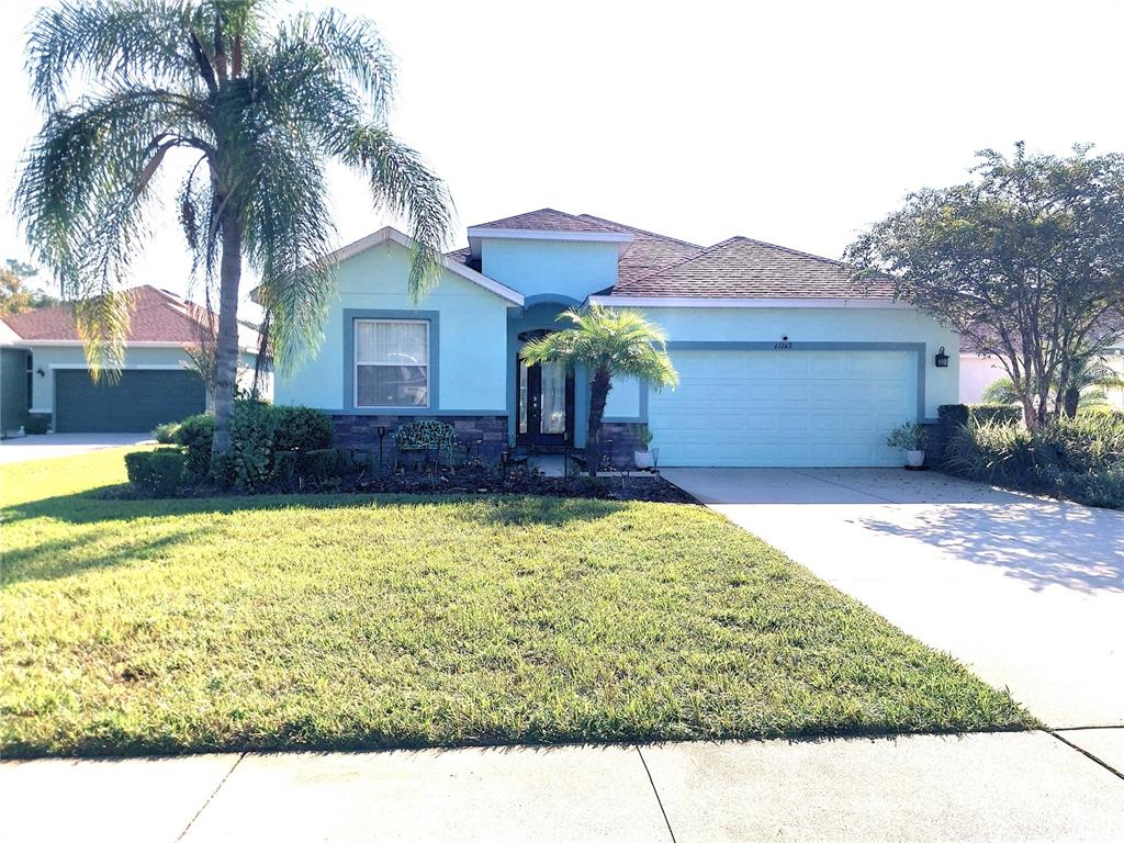 a view of a house with a yard