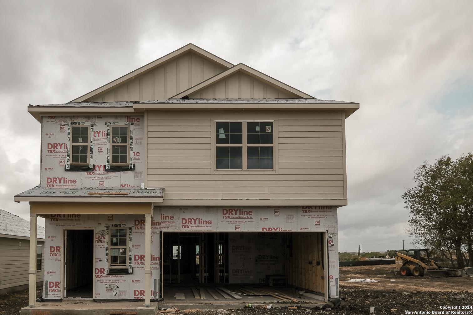 a front view of a house with a garage