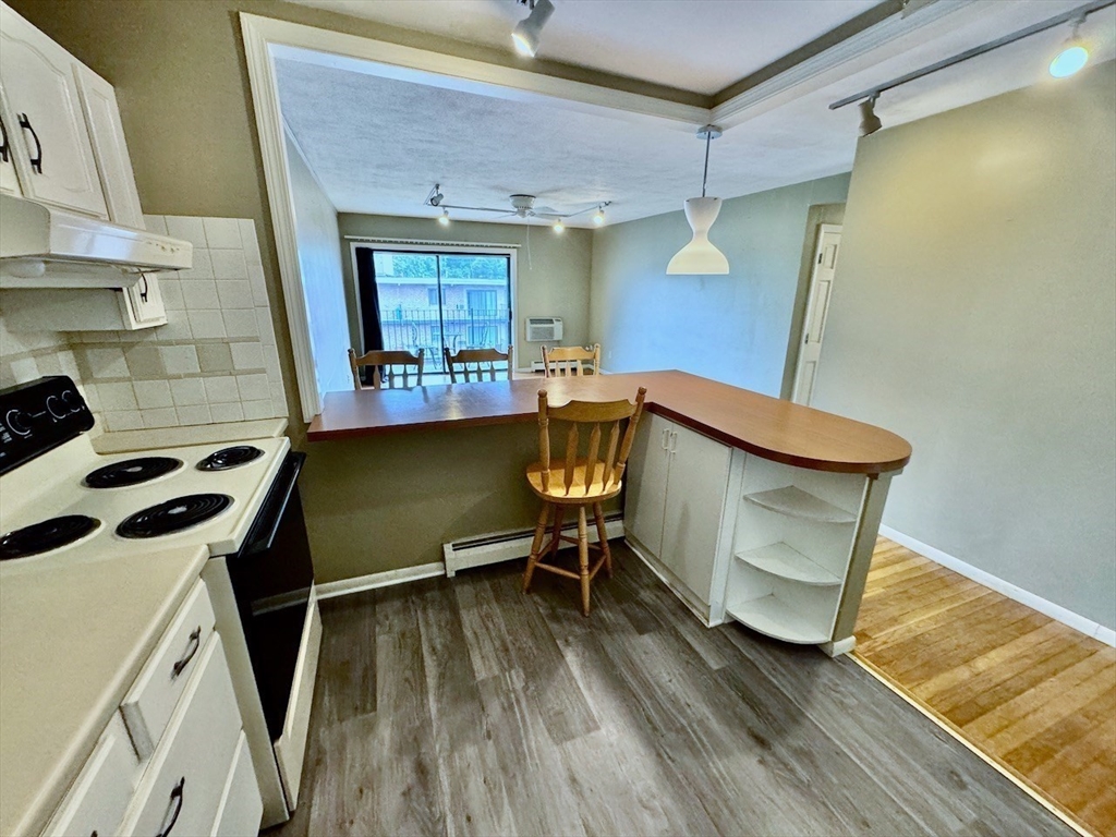 a room with wooden floors and furniture