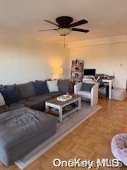 a living room with furniture and a rug