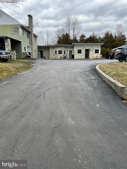 a view of a house with a flat and road