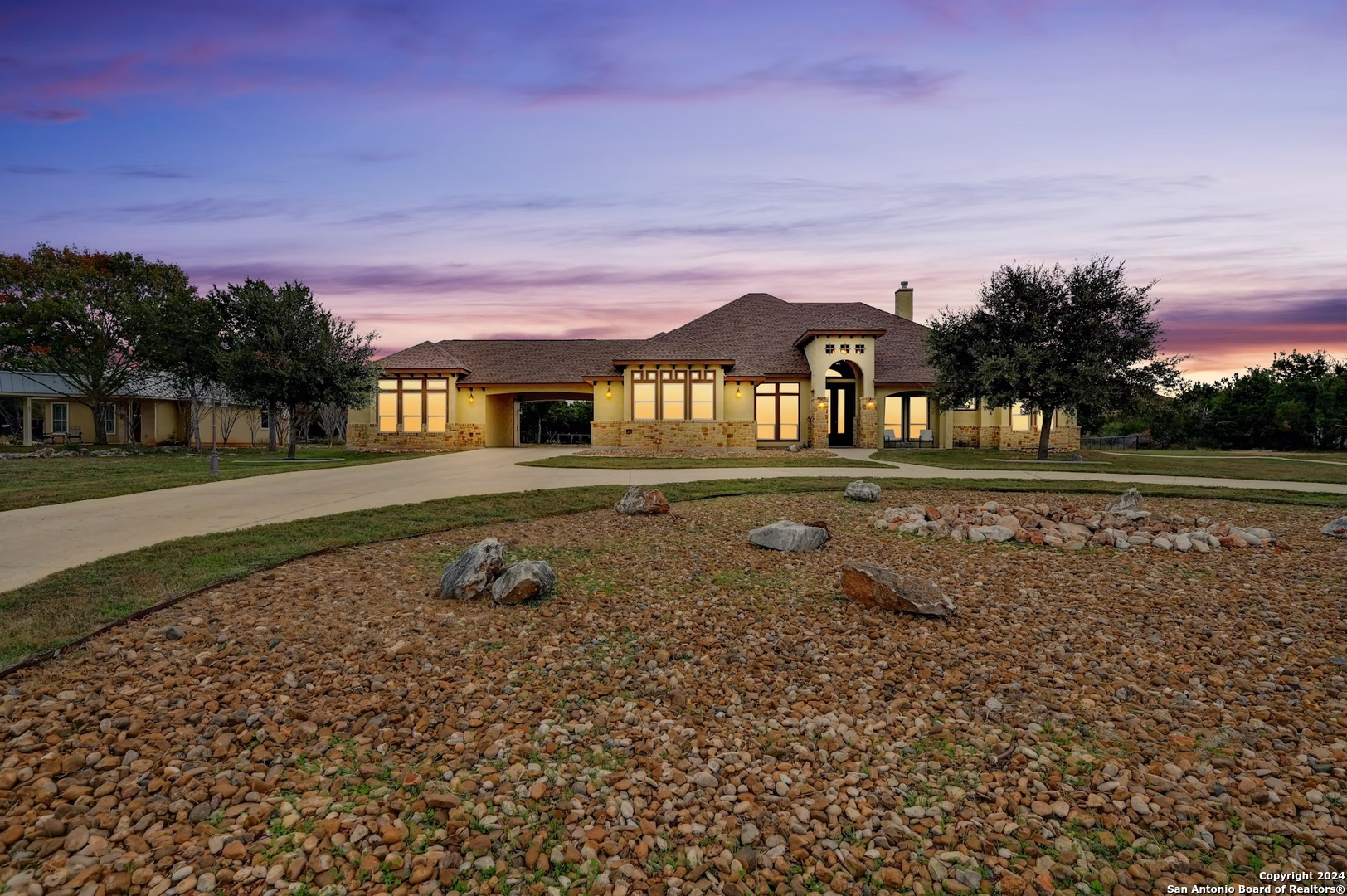 a front view of a house with a yard