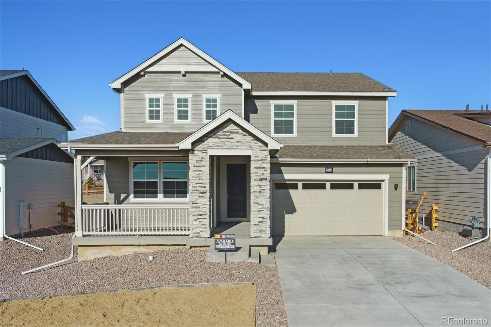 a view of a house with a yard and garage