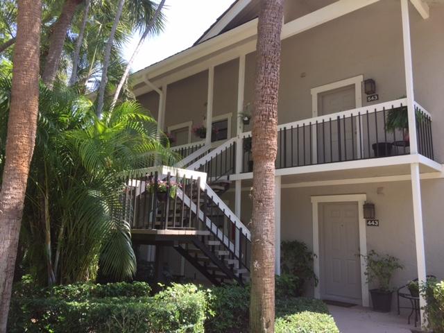 a view of front door and small plants