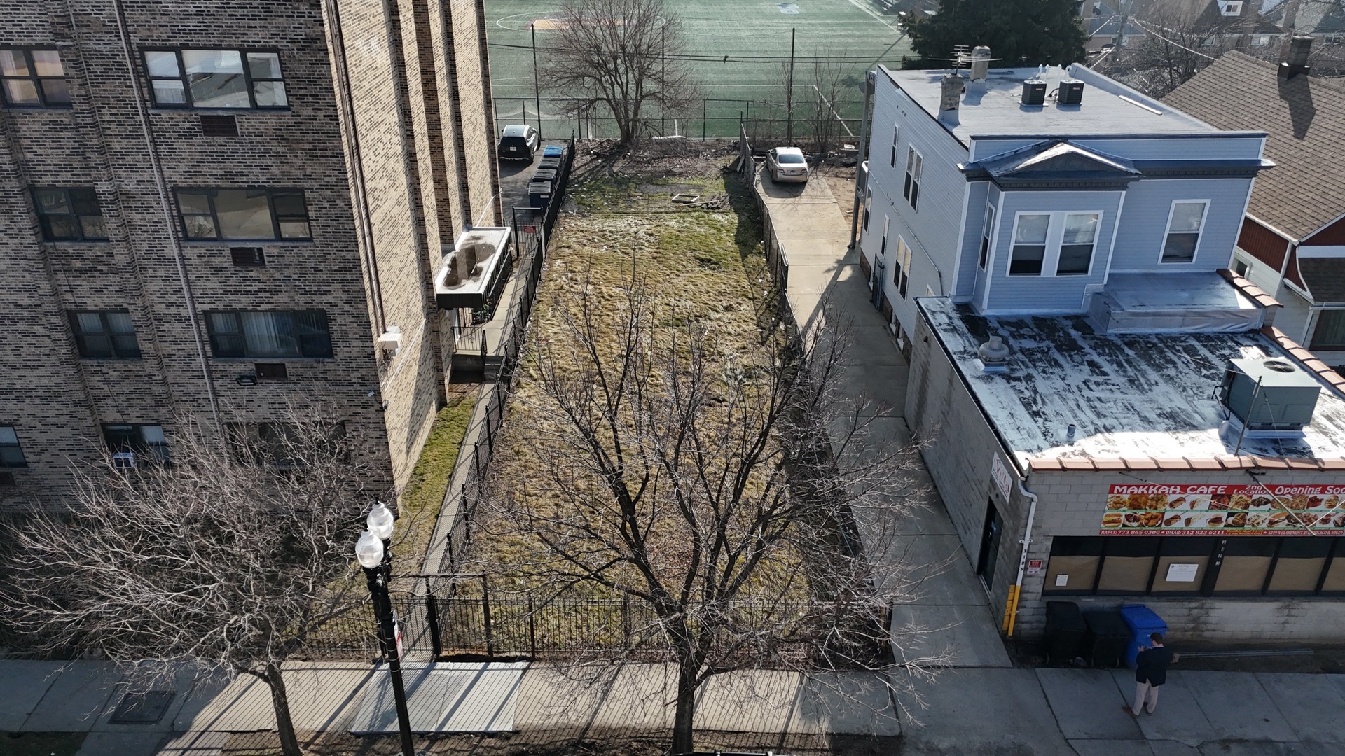 a aerial view of a house with a yard