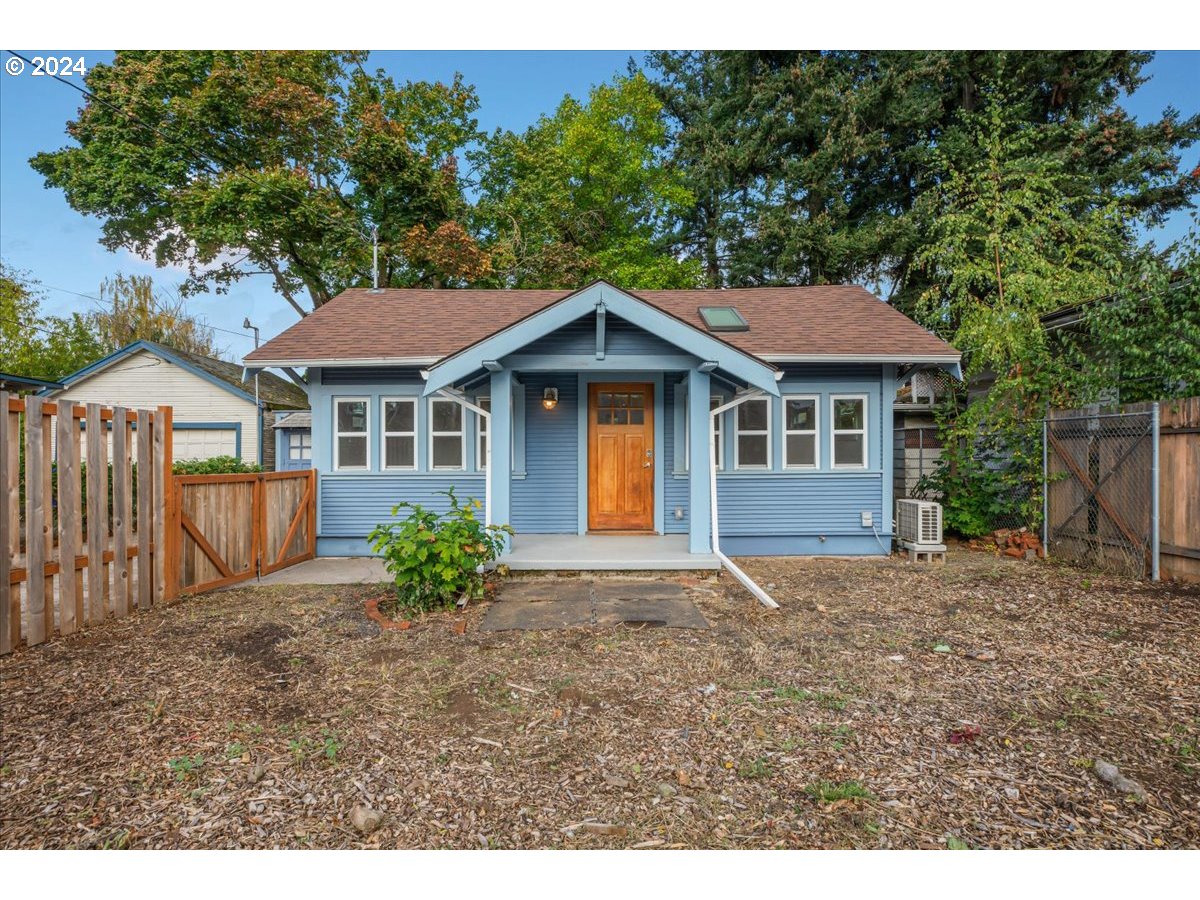 a house with a tree in front of it