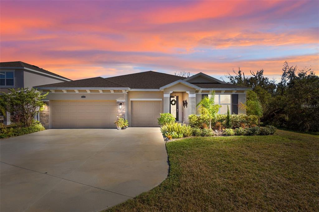 front view of a house with a yard