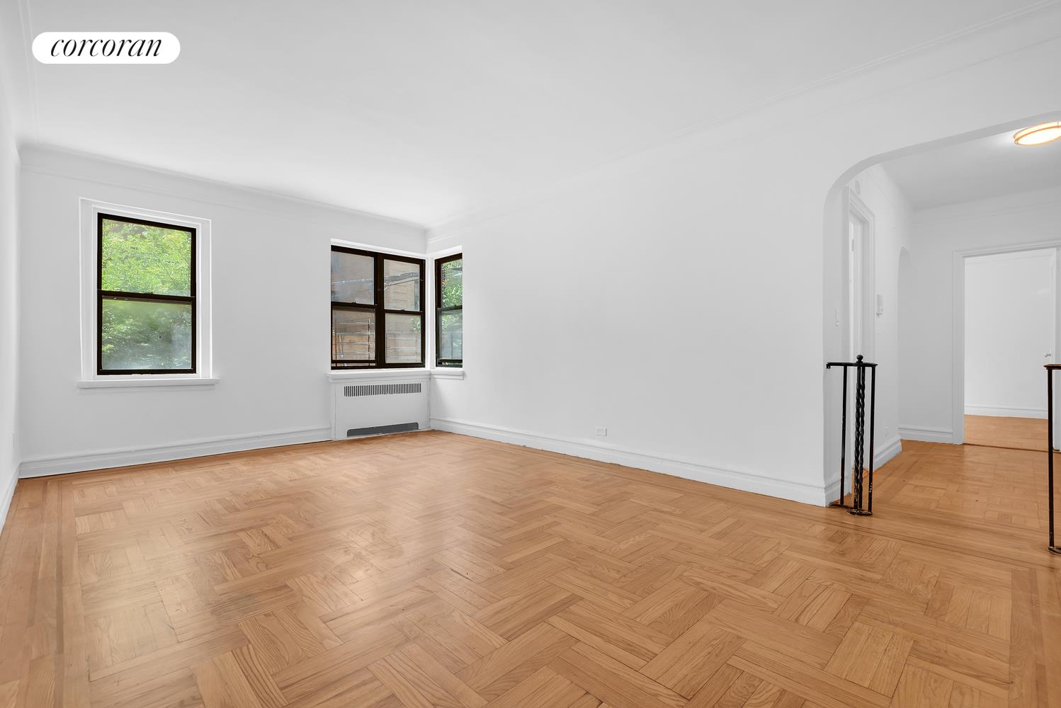 a view of a big room with windows and closet