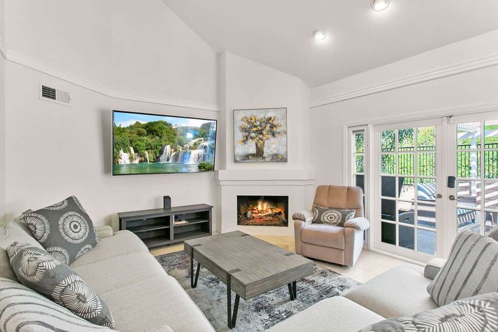 a living room with furniture and a fireplace