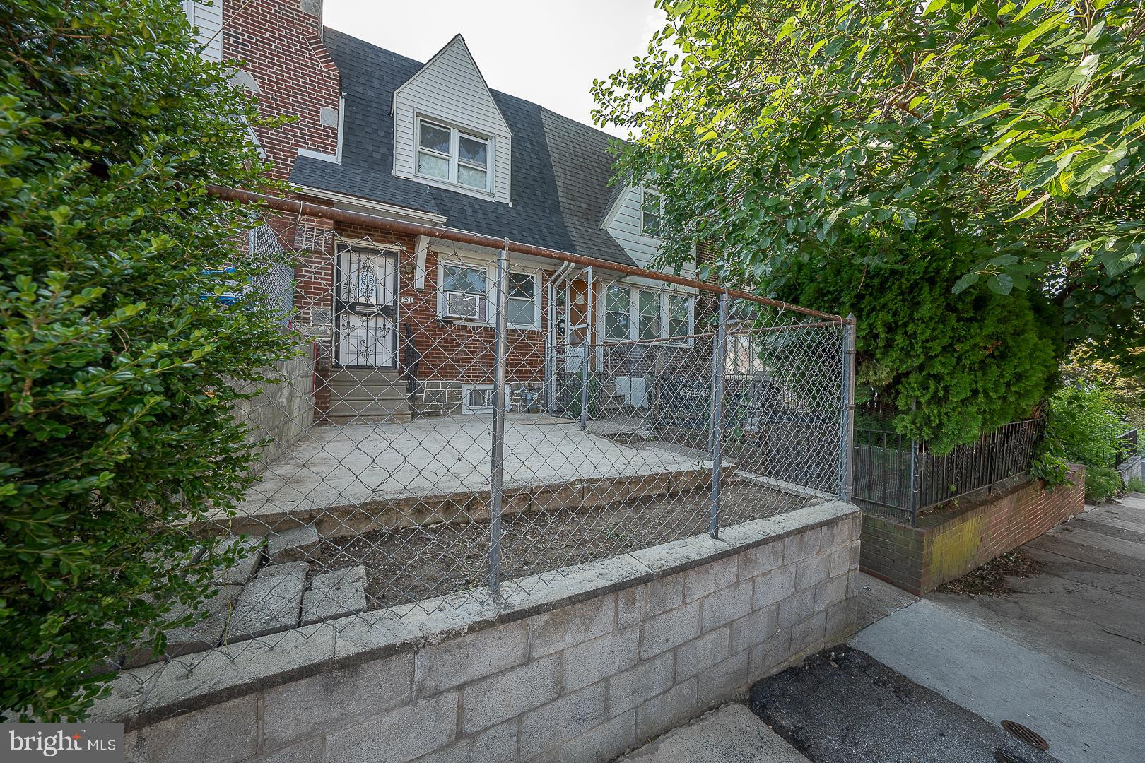 a view of a brick house with a yard