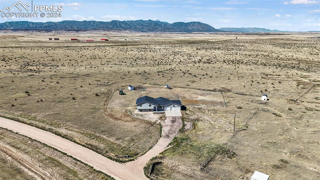 Loafing shed and pasture for horses fenced on right side of the picture