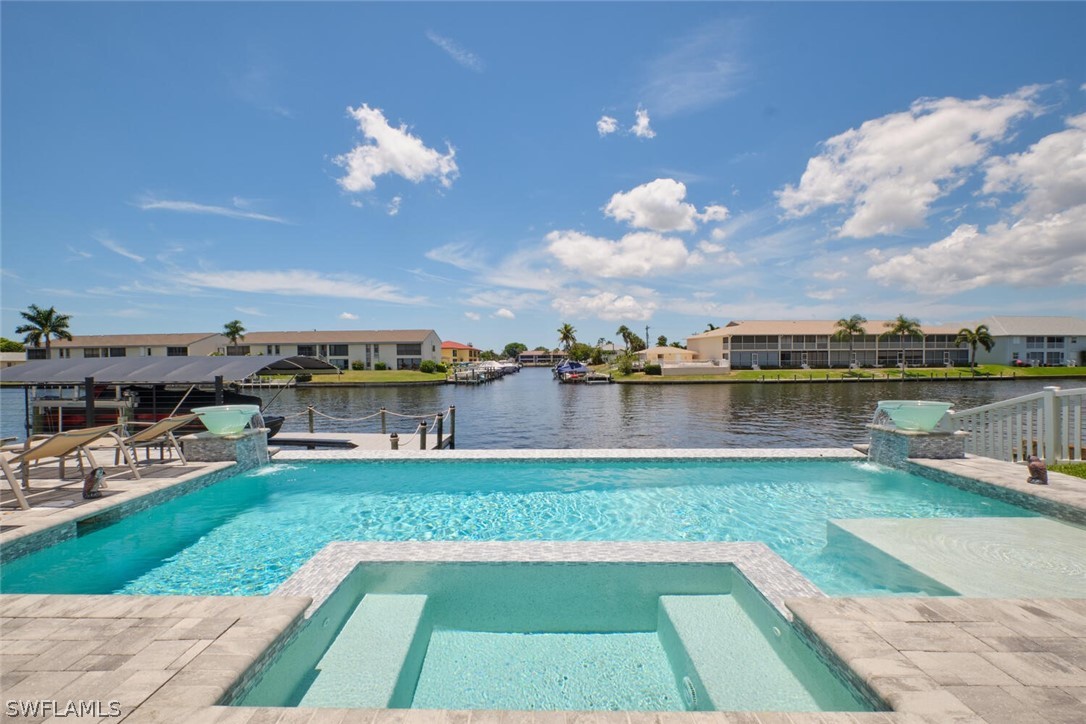 a view of a swimming pool and a yard