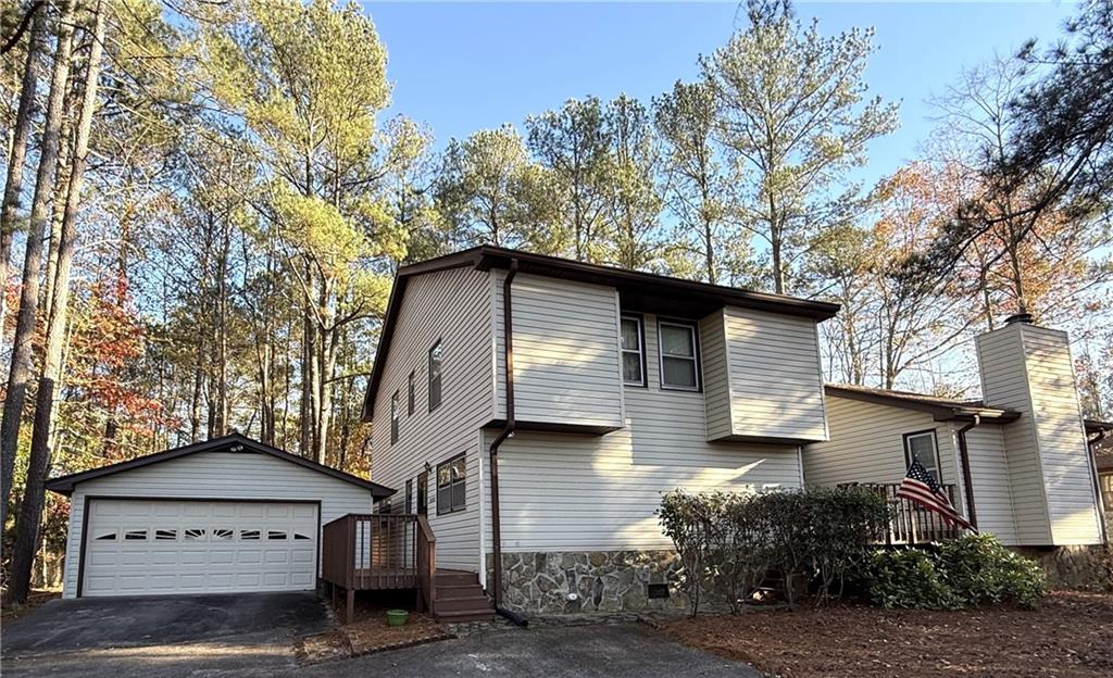 a house that has a tree in front of the house