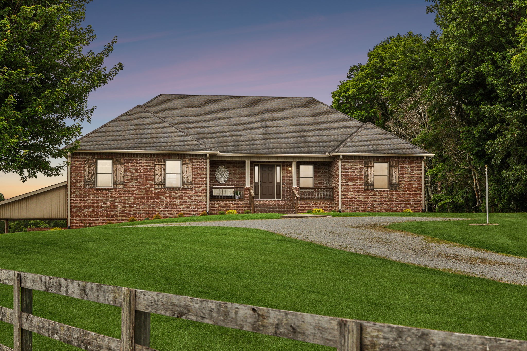 a front view of a house with a garden