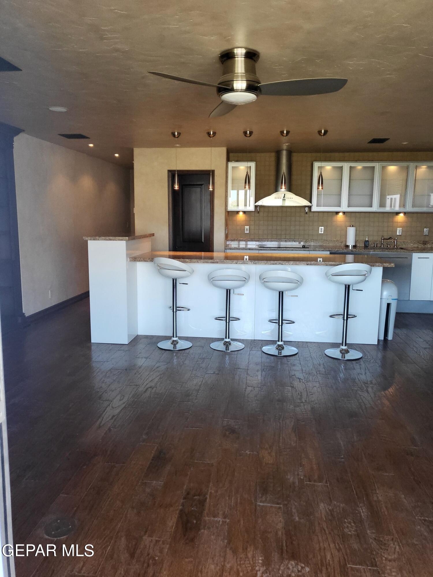 a living room with granite countertop furniture and fireplace