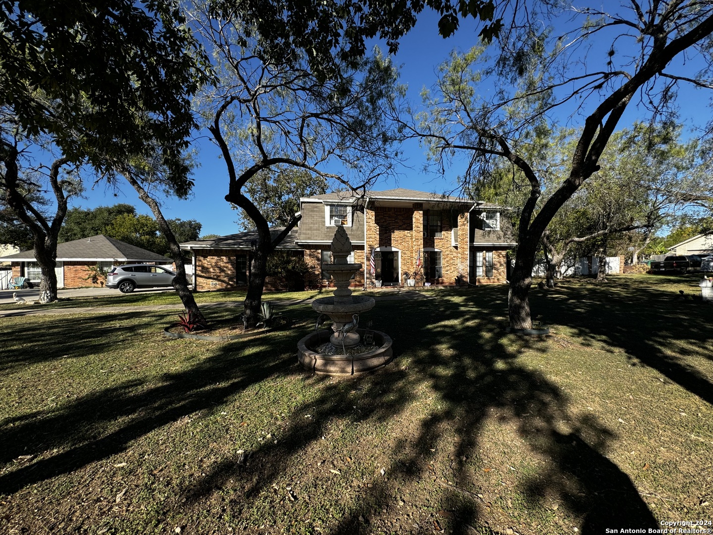 a view of a backyard of the house