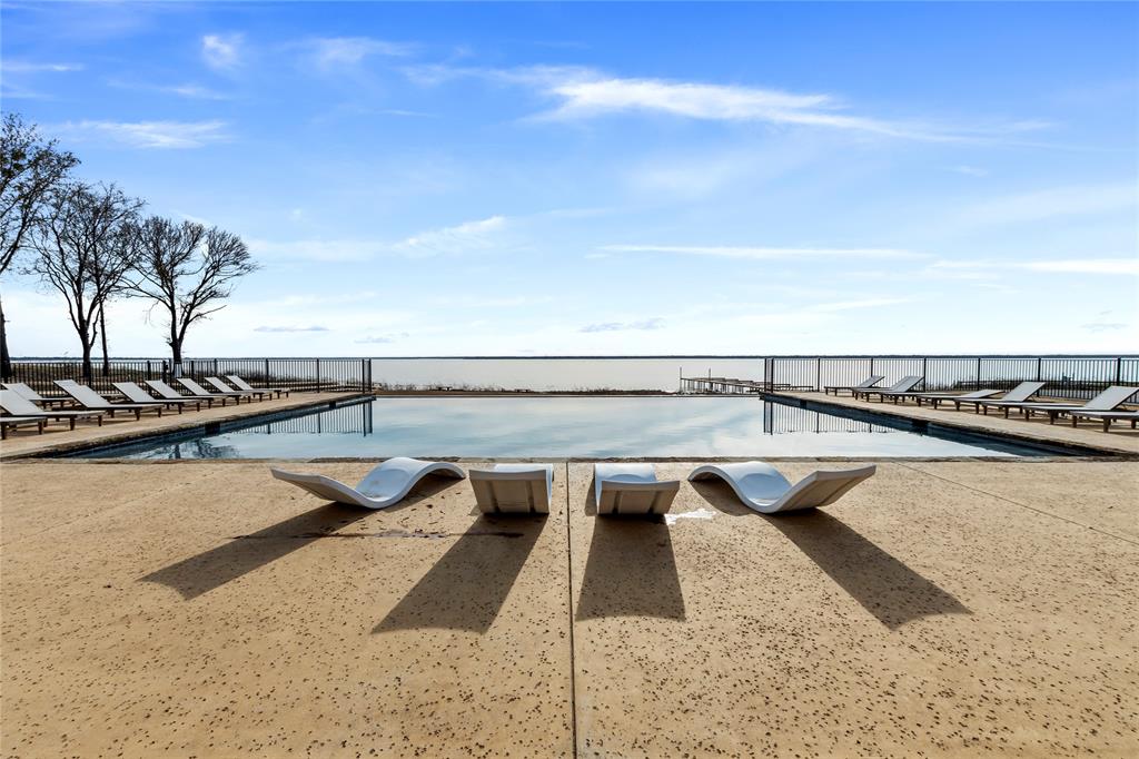 a view of swimming pool with seating space