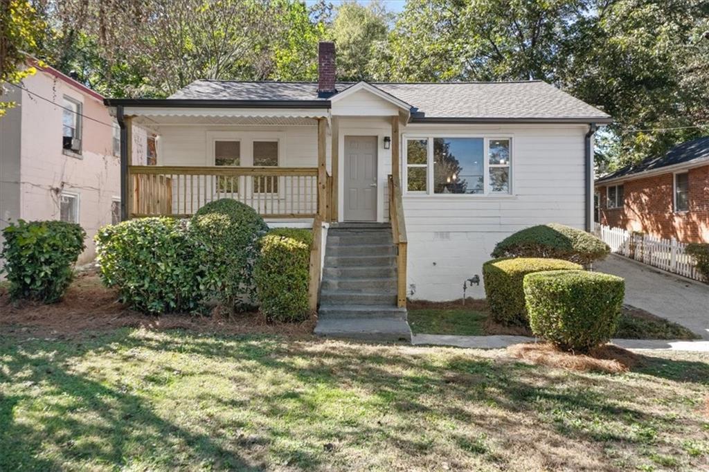 a front view of a house with garden