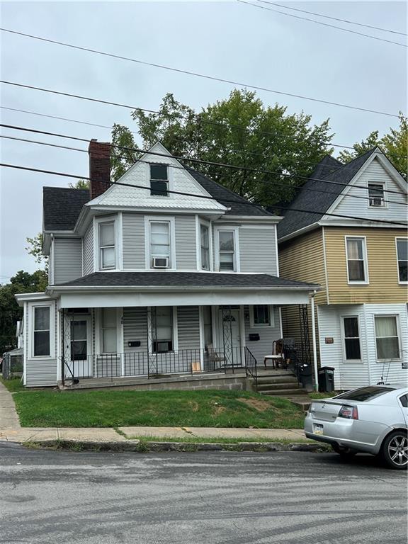 a front view of a residential apartment building with a yard