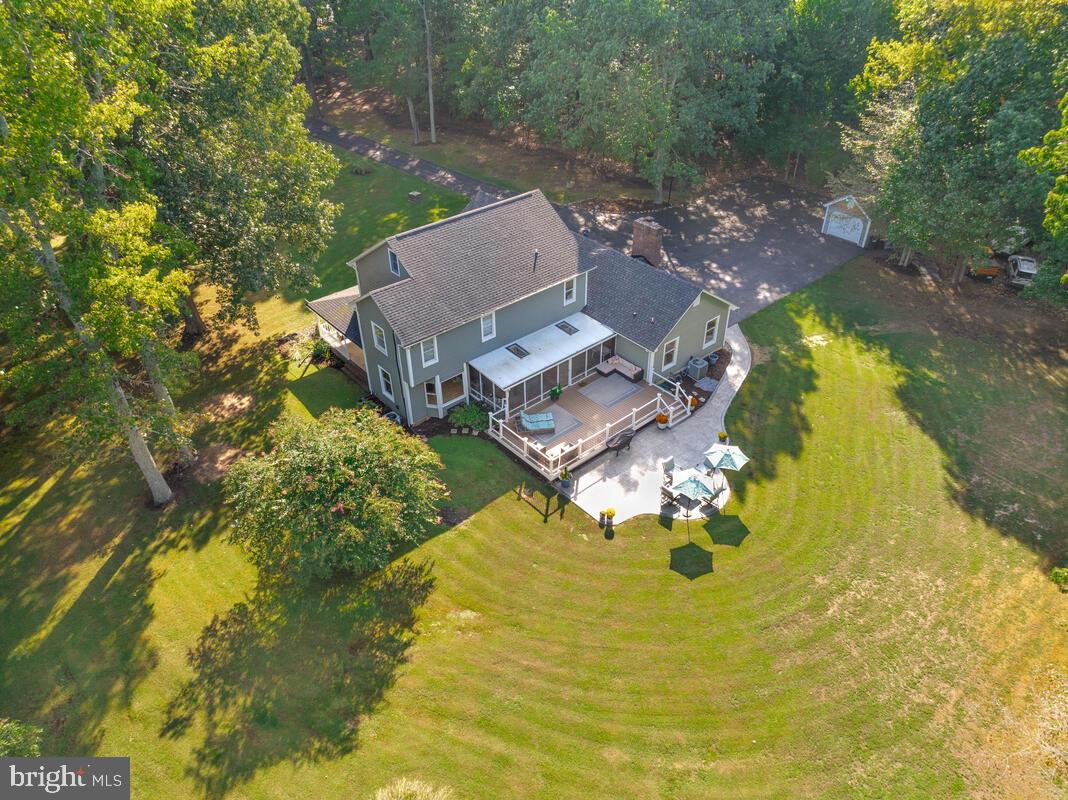 a aerial view of a house with swimming pool