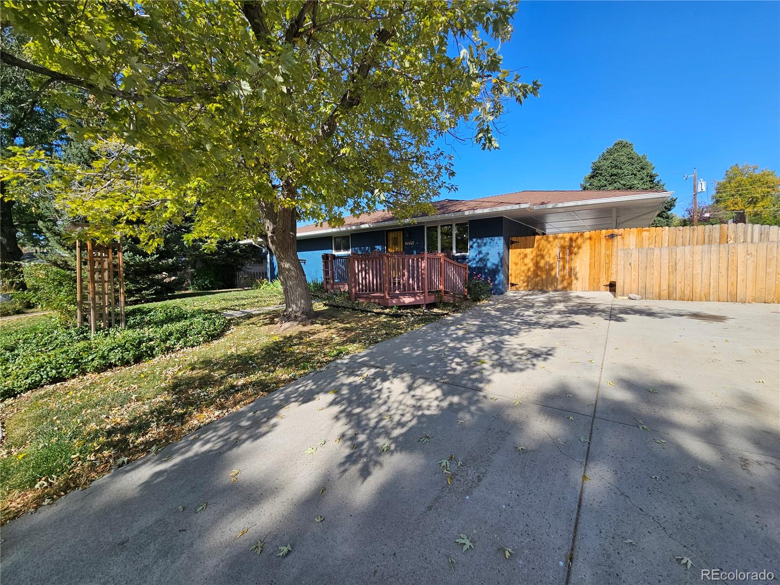 a view of a house with a yard and garage