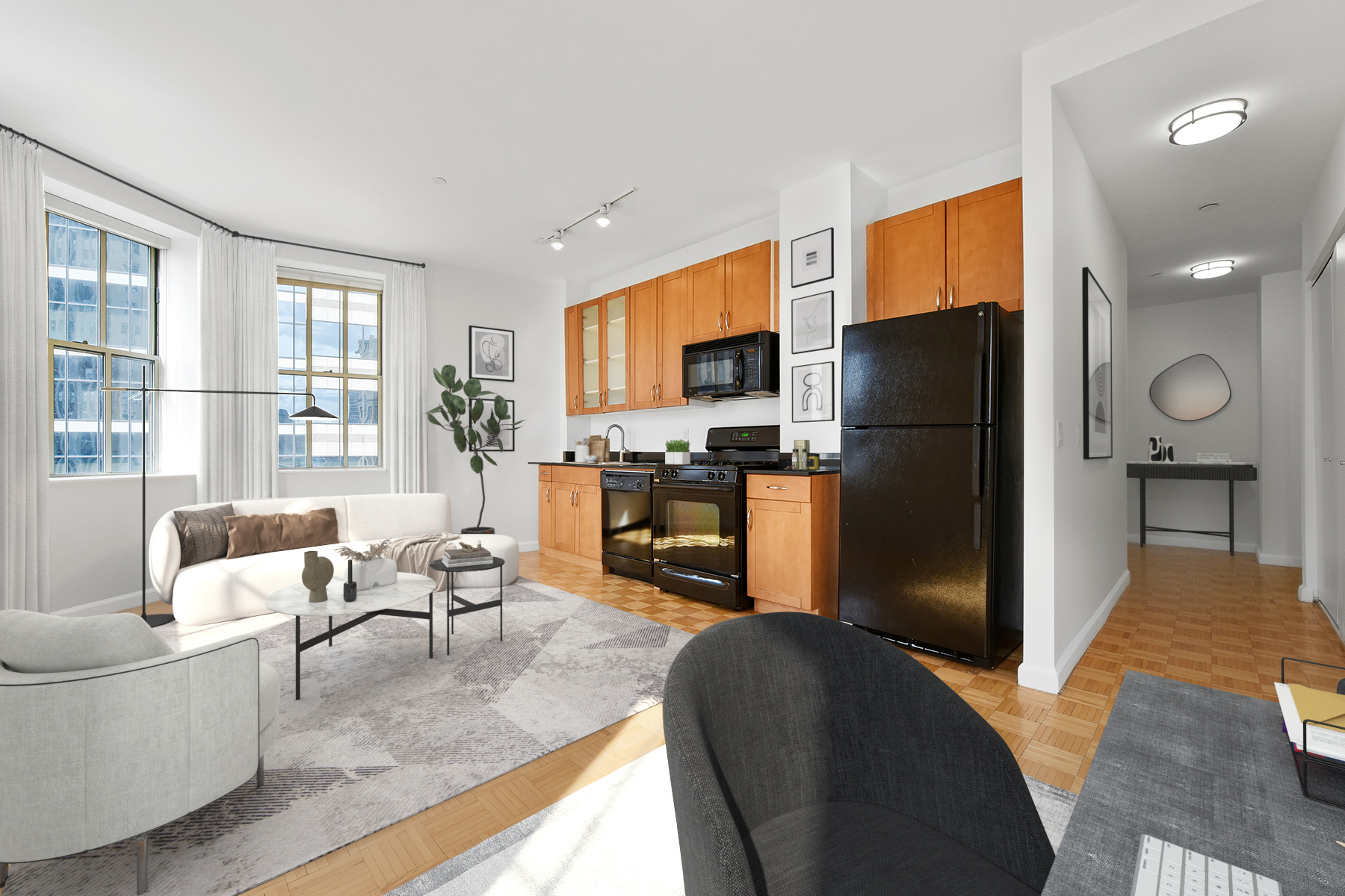 a living room with furniture a large window and stainless steel appliances