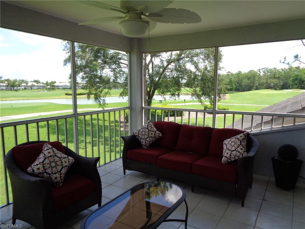 a building outdoor space with patio couches and pool view