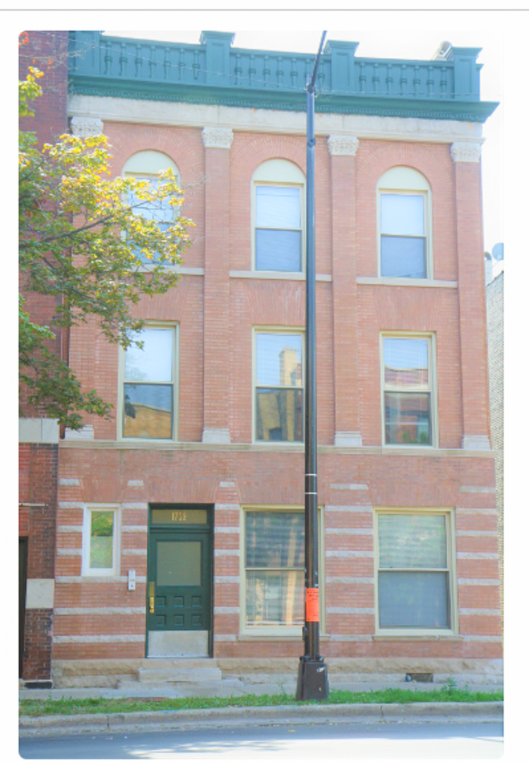 a front view of a multi story residential apartment building