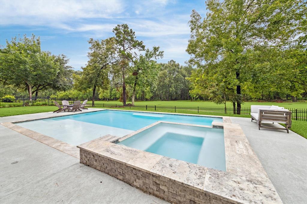 a view of a swimming pool with a yard