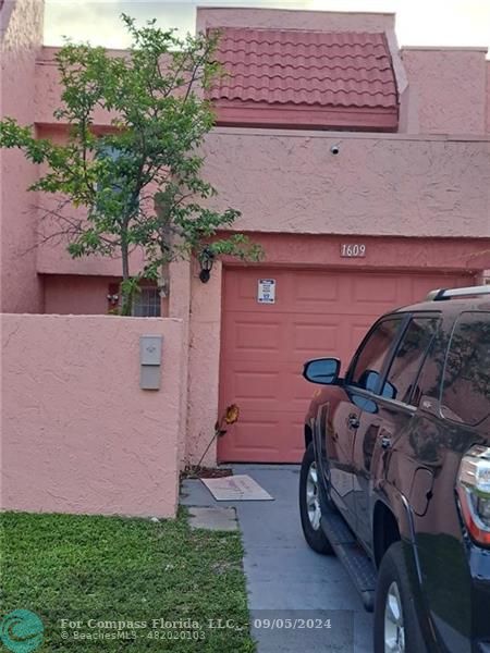 a car parked in front of a house