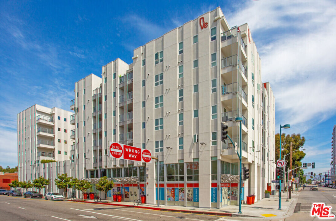 a view of a multi story building with a street