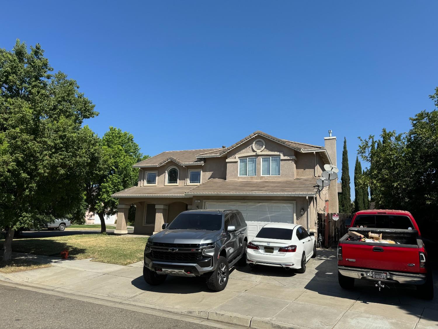 a front view of a house with parking space