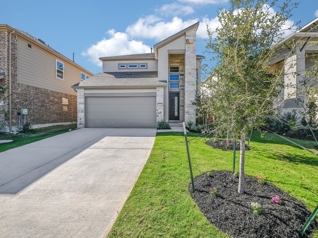 a front view of a house with a yard