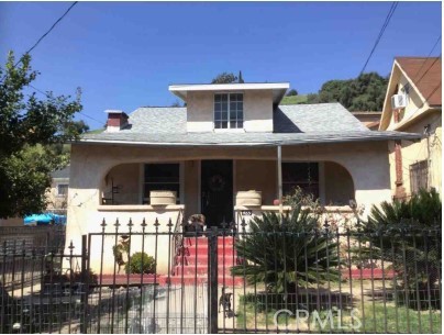 a front view of a house with yard