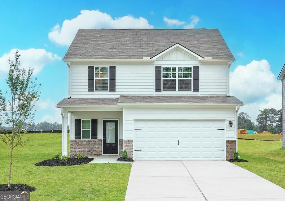 front view of a house with a yard