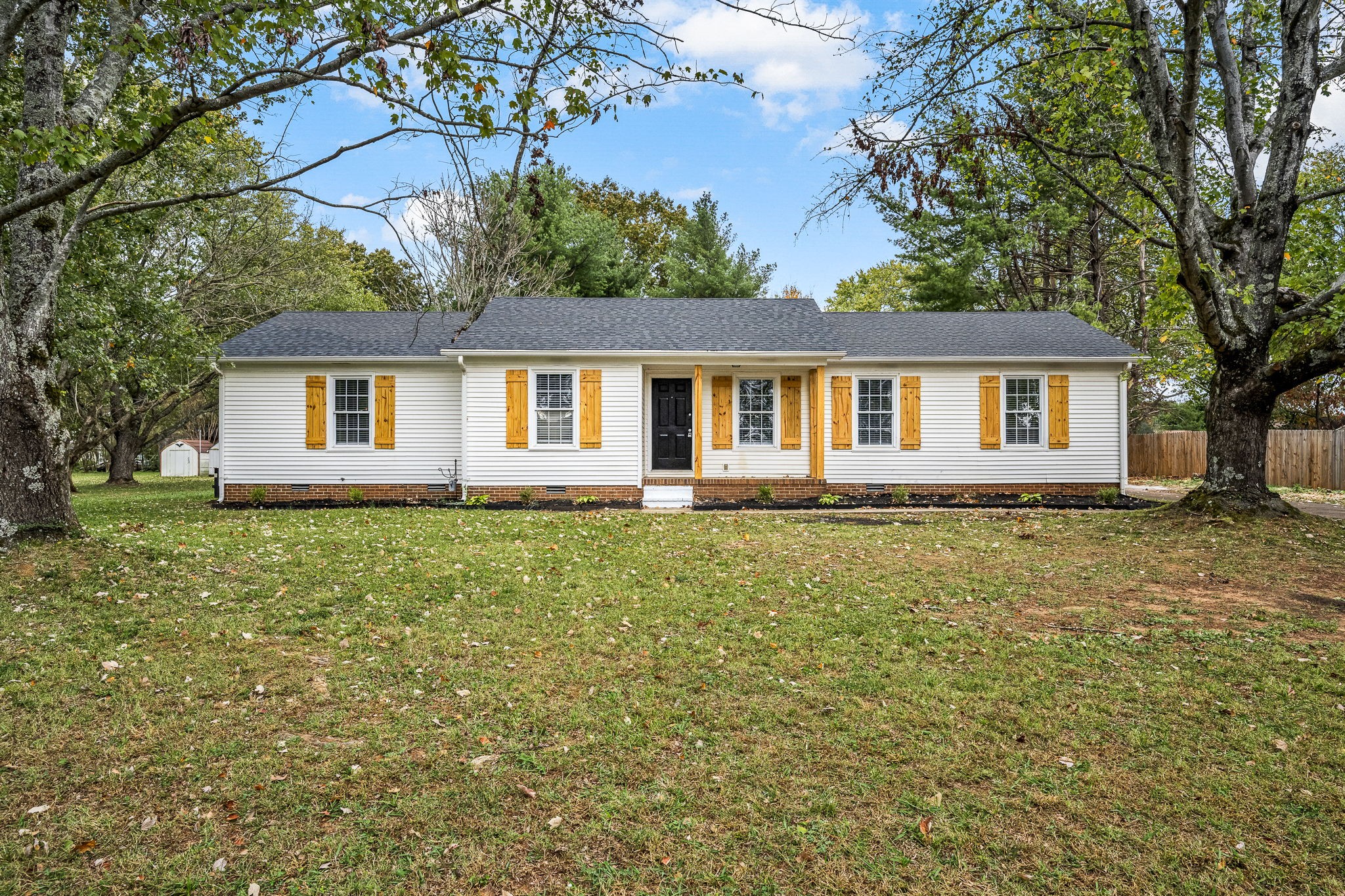 a front view of a house with yard