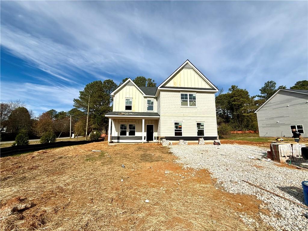 a view of open space with yard and garage