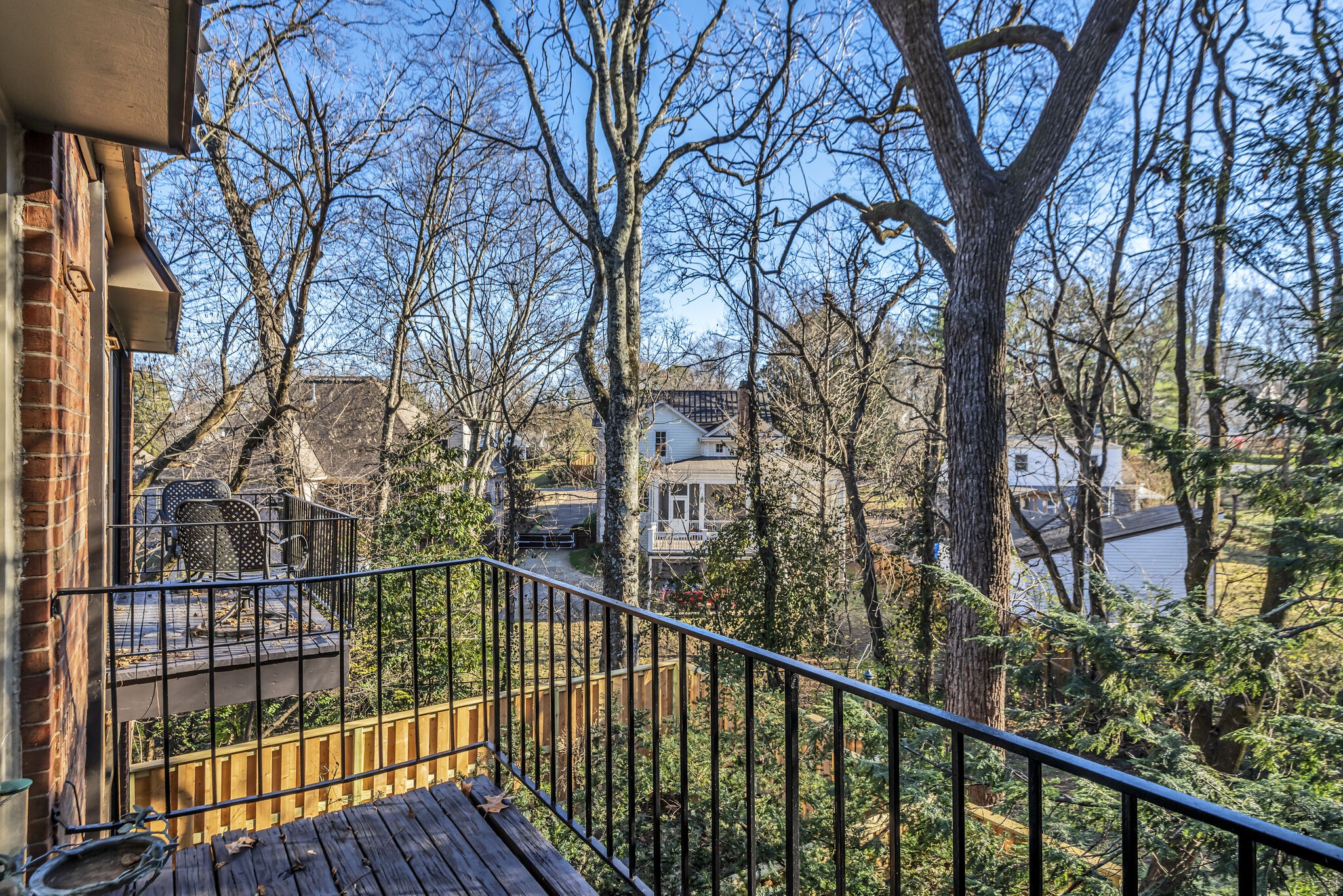 a view of a balcony with a trees