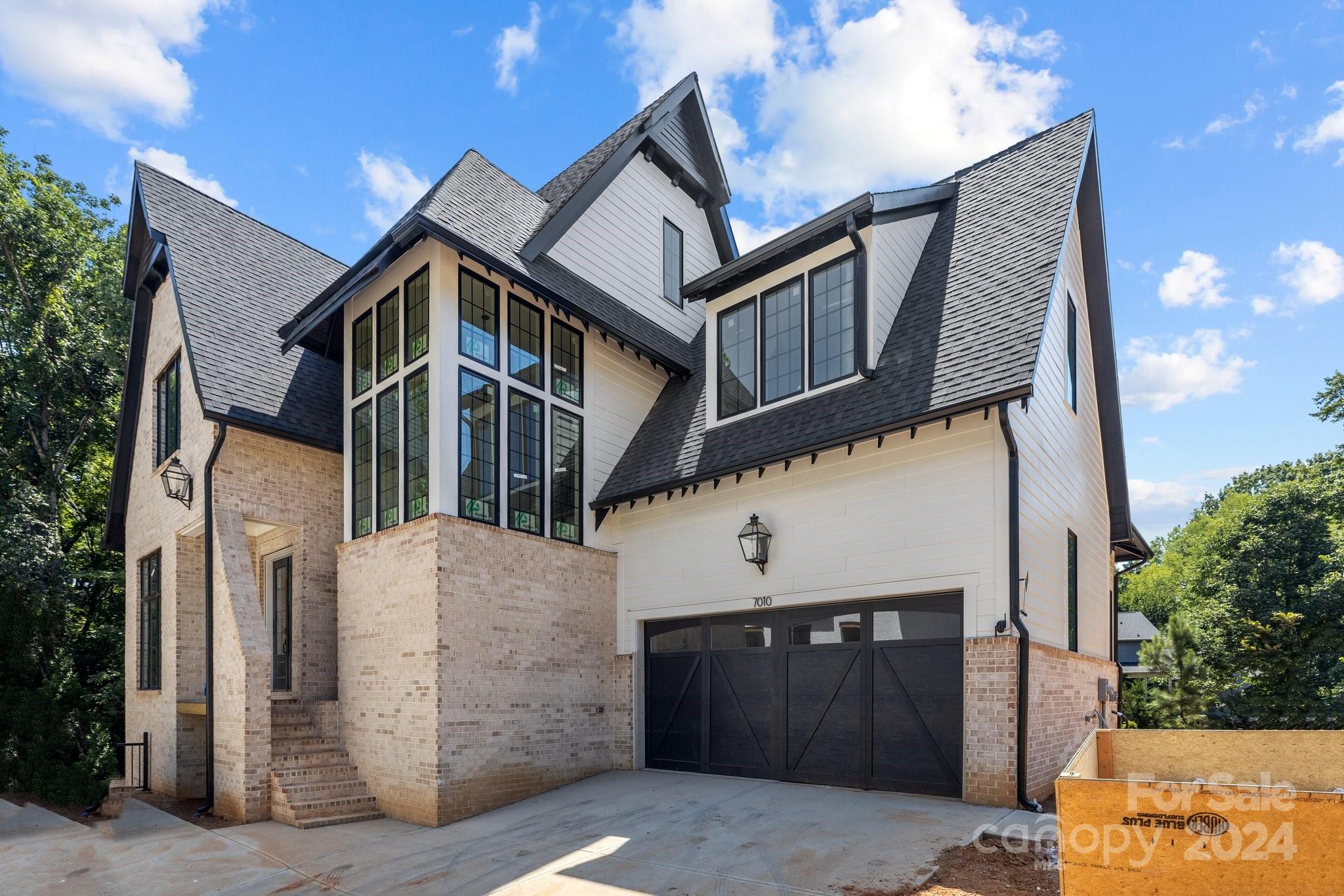 a front view of a house with a garage